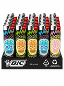 A retail display tray of BIC lighteres featuring colorful sugar skull designs on the lighter bodies, with red and silver tops visible behind them, set against a plain white background.