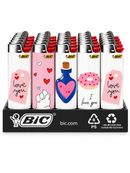 A retail display of BIC refillable paper lighters on a black stand. The lighters feature white bodies with various colorful designs including pink 'love you' tags, a blue heart-shaped bottle, a pink donut, and red tops.