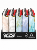 A BIC branded display stand holding multiple lighter burners with marble-patterned bodies in white, beige, green, blue, and gold tones, plus red tips, on a white background.