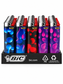 A retail display tray filled with BIC molten lighter bottles, each featuring a different colorful lava-patterned body in blue, purple, red, and pink, with silver metal tops and red tips.