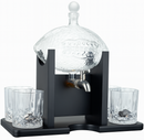 Glass drink dispenser with black stand and four glasses on a white background