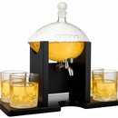 Glass drink dispenser with four glasses filled with a yellow liquid on a white background