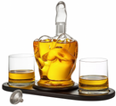 Whiskey decanter with two glasses on a wooden coaster, filled with amber liquid.