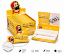 Zig-Zag Crystal rolling papers in a yellow retail display box with an open tray showing white double-sided rolling papers. A smaller single packet and an inset circle highlight the double paper construction.