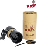 The image shows a black RAW Six Shooter King Size cone filler device, with its lid open to display the interior. A cone loader tool is also visible.